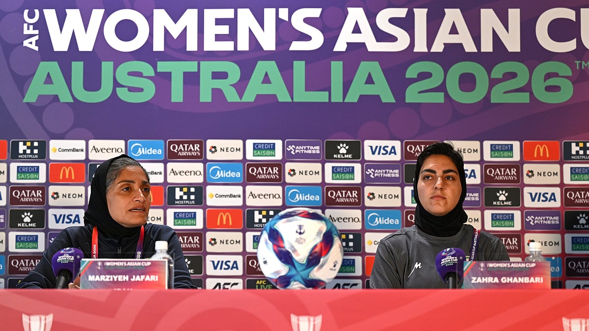 | Photo: AP/DAVE HUNT : Iranian women's national soccer team coach Marziyeh Jafari, left, and captain Zahra Ghanbari react during a press conference ahead of their game against South Korea on Monday at Robina Stadium on the Gold Coast, Australia, Sunday, March 1, 2026. 
