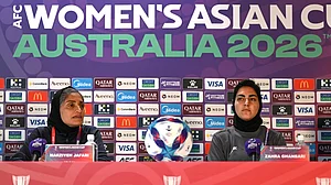 | Photo: AP/DAVE HUNT : Iranian women's national soccer team coach Marziyeh Jafari, left, and captain Zahra Ghanbari react during a press conference ahead of their game against South Korea on Monday at Robina Stadium on the Gold Coast, Australia, Sunday, March 1, 2026.