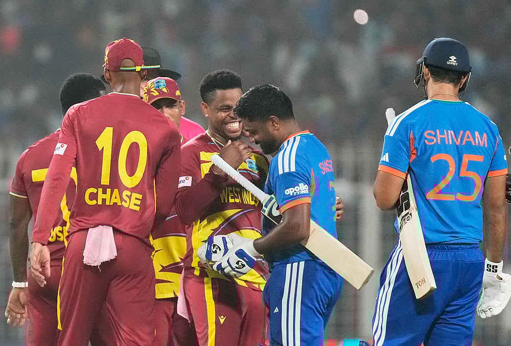 | Photo: AP/Bikas Das : West Indies Shimron Hetmyer, center, chats with Indias Sanju Samson after India won the T20 World Cup cricket match against West Indies in Kolkata.