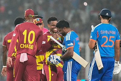 | Photo: AP/Bikas Das : West Indies Shimron Hetmyer, center, chats with Indias Sanju Samson after India won the T20 World Cup cricket match against West Indies in Kolkata.