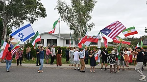 | Photo: Mick Tsikas/AAP Image via AP : Iranian Australians react outside Iran's embassy in Canberra, Australia.