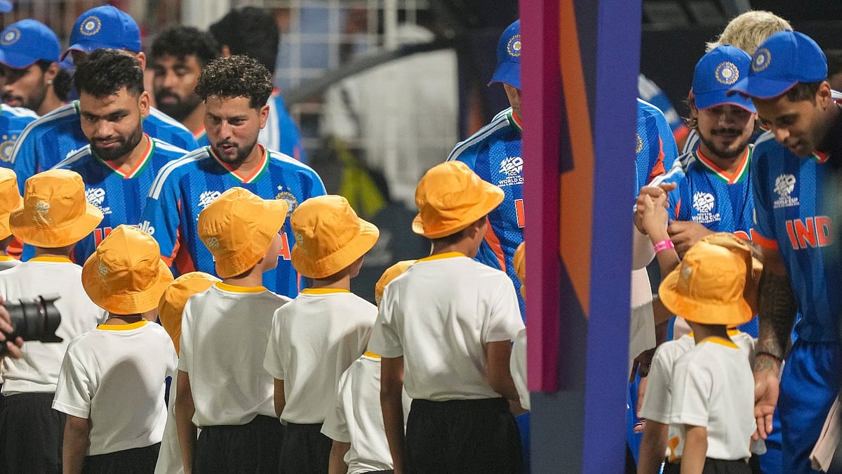 (PTI Photo/Swapan Mahapatra) : Kolkata: Indias captain Suryakumar Yadav, Rinku Singh, Kuldeep Yadav and Ishan Kishan interact with children before an ICC Mens T20 World Cup 2026 cricket match between India and West Indies, at the Eden Gardens, in Kolkata, West Bengal, Sunday, March 1, 2026