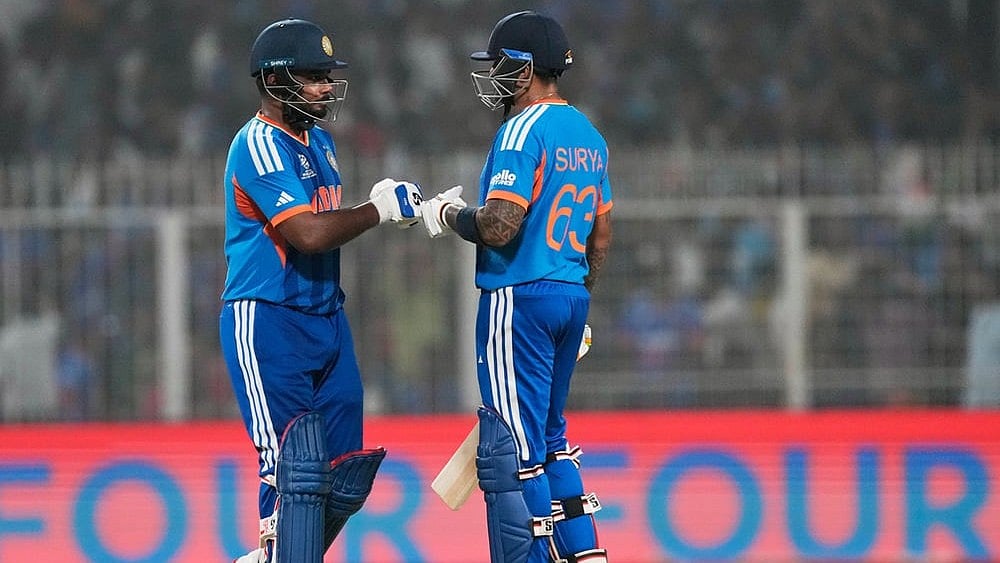 | Photo: AP/ Bikas Das : Indias captain Suryakumar Yadav, right, and batting partner Sanju Samson touch gloves during the T20 World Cup cricket match between India and West Indies in Kolkata.