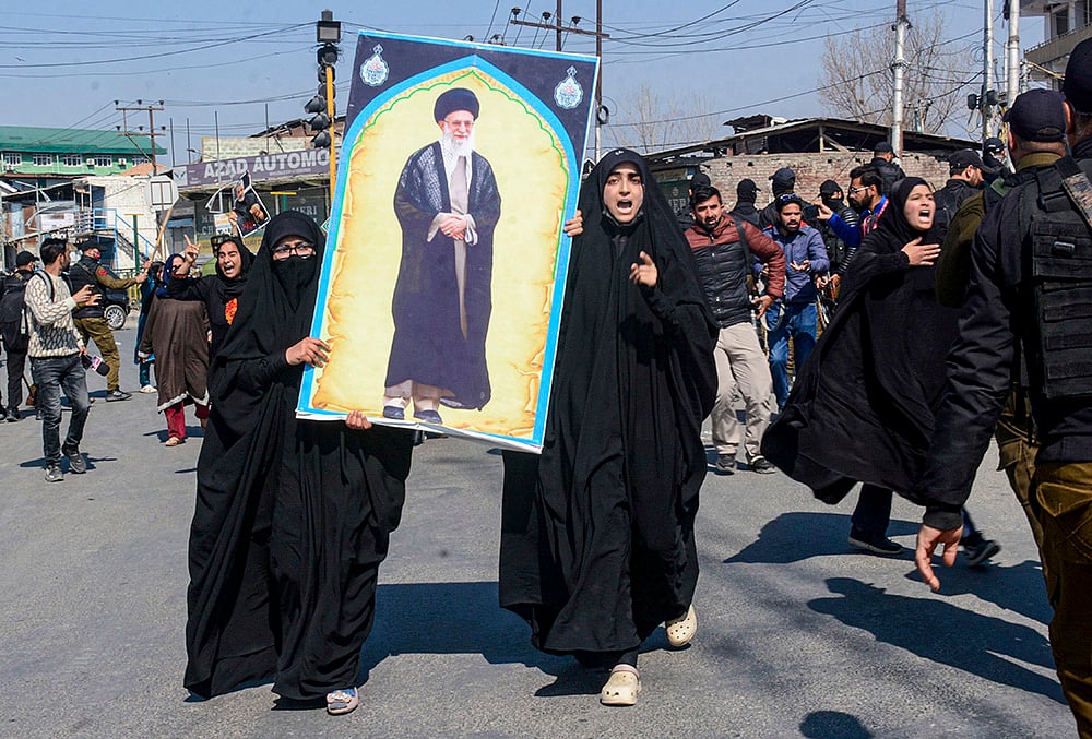 | Photo: PTI  : People stage a protest over the killing of Irans Supreme Leader Ayatollah Ali Khamenei in joint air strikes by the US and Israel, amid severe restrictions on the movement of people in parts of Kashmir, Srinagar.