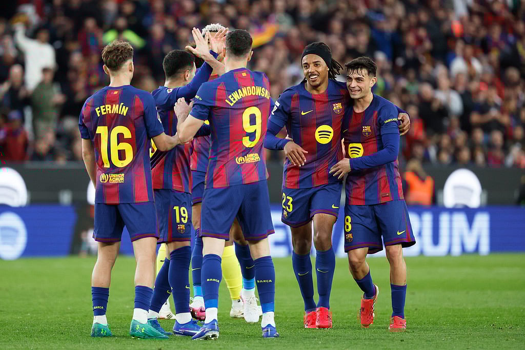 | Photo: AP/Joan Monfort : Barcelonas Robert Lewandowski (9) is congratulated after scoring his sides 4th goal during the Spanish La Liga soccer match between Barcelona and Villareal in Barcelona, Spain.