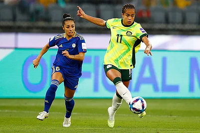 | Photo: AP/Gary Day : Australias Mary Fowler kicks the ball clear of Philippines Jaclyn Sawicki, left, during the Womens Asia Cup soccer match between Australia and the Philippines in Perth, Australia.