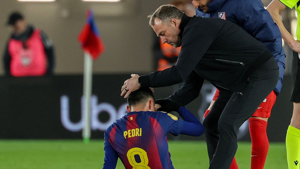 Barcelona head coach Hansi Flick consoles Pedri after Copa del Rey exit