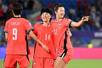 | Photo: Dave Hunt/AAPImage via AP : South Koreas Choe Yu-ri, right, is congratulated by teammates after scoring her teams first goal during the Womens Asia Cup soccer match between Iran and South Korea on the Gold Coast, Australia.