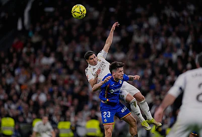 | Photo: AP/Manu Fernandez : Getafes Adrian Liso jumps for the ball against Real Madrids Brahim Diaz during a Spanish La Liga soccer match between Real Madrid and Getafe in Madrid, Spain.