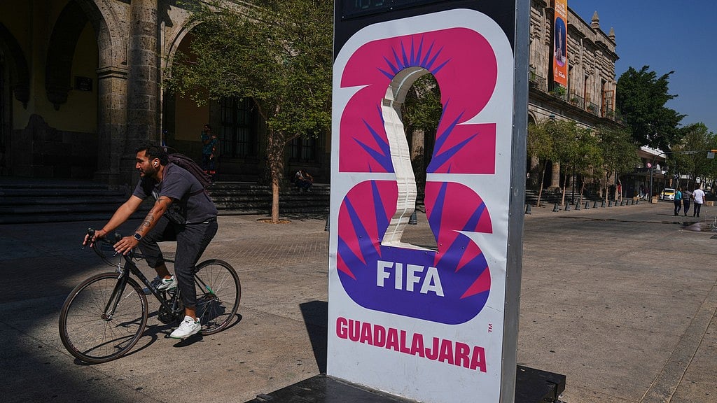 | Photo: AP : A cyclist rides past an installation promoting the FIFA World Cup 2026 in Guadalajara, Mexico.