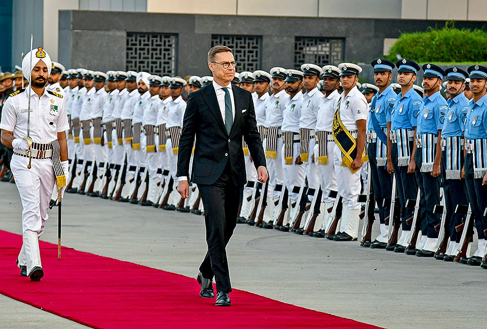 | Photo: PIB via PTI  : Finnish President Alexander Stubb being accorded a Guard of Honour upon his arrival at the Palam Air Force Station, in New Delhi. 