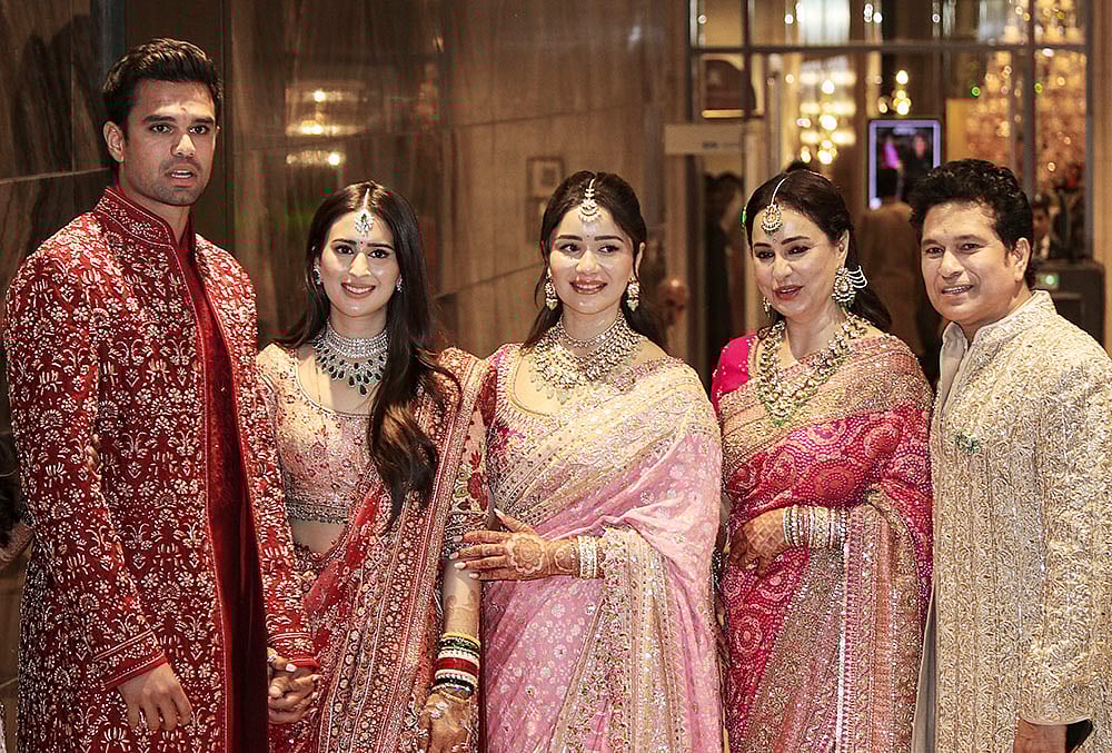 | Photo: PTI : From right, Cricketer Sachin Tendulkar, with wife Anjali Tendulkar, daughter Sara Tendulkar during his sons Arjun Tendulkar and industrialist Ravi Ghai’s granddaughter Saaniya Chandhok wedding ceremony, in Mumbai.