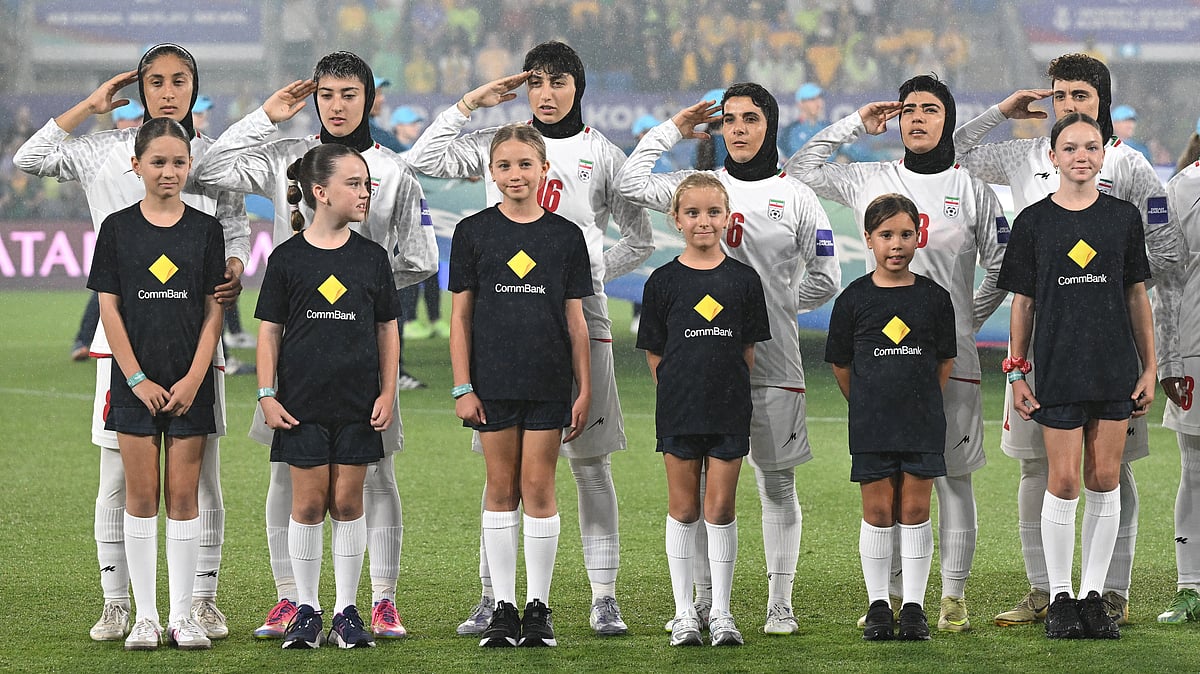 (Dave Hunt/AAPImage via AP) : Iran players react during their national anthem ahead of the Women's Asia Cup soccer match between Australia and Iran in Robina, Australia, Thursday, March 5, 2026. 