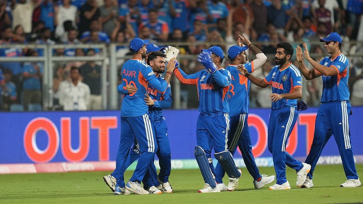AP Photo/Rafiq Maqbool : Indian players celebrate the dismissal of Englands Will Jacks during the T20 World Cup cricket semi-final match between India and England in Mumbai, India, Thursday, March 5, 2026. 