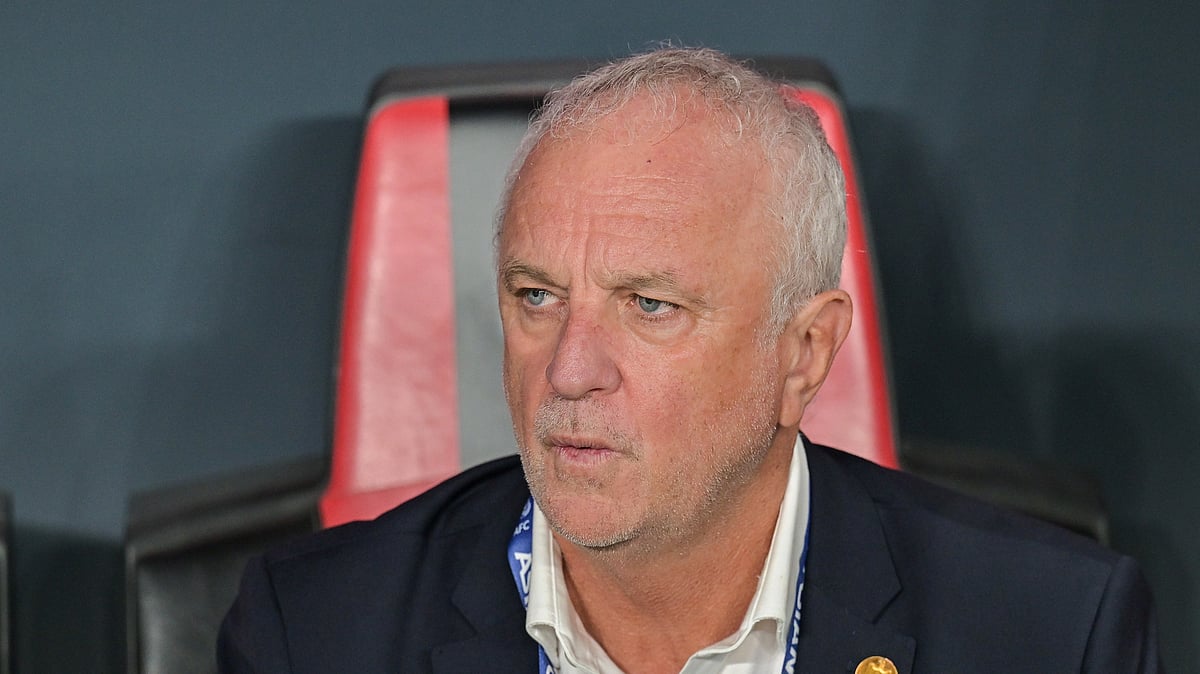 (AP Photo/Walid Ibrahim, File) : FILE- Iraqi's head coach Graham Arnold sits on the bench at the start of the 2026 World Cup play off first leg soccer match between UAE and Iraq in Abu Dhabi, United Arab Emirates, Friday, Nov. 14, 2025. 