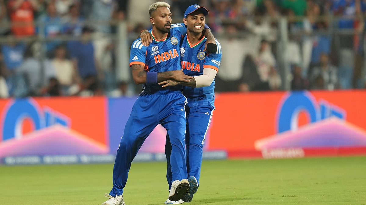 (AP Photo/Rafiq Maqbool) : Indias Hardik Pandya, left, celebrates with captain Suryakumar Yadav after the dismissal of Englands Phil Salt during the T20 World Cup cricket semi-final match between India and England in Mumbai, India, Thursday, March 5, 2026