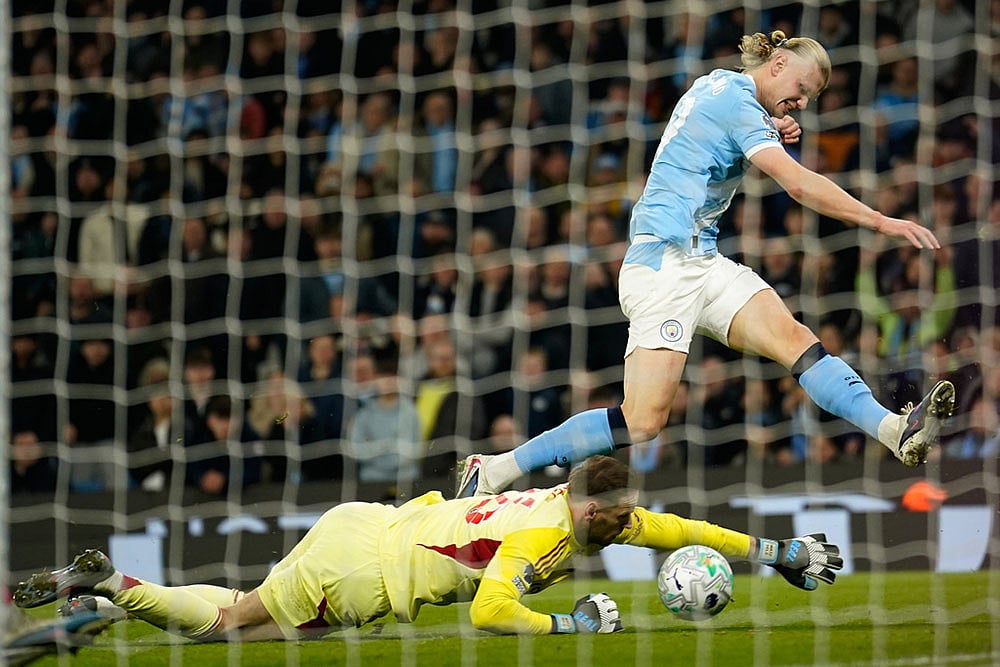 | Photo: AP/Dave Thompson : Nottingham Forests goalkeeper Matz Sels saves at the feet of Manchester Citys Erling Haaland during the English Premier League soccer match between Manchester City and Nottingham Forest in Manchester, England.