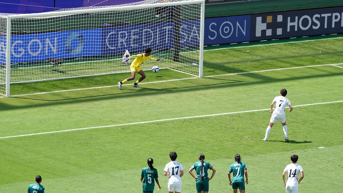 | Photo: AP/Rick Rycroft : North Korea's Myong Yu Jong, right, scores against Bangladesh's goalkeeper Mile Akter from a penalty during their Women's Asian Cup match in Sydney, Friday, March 6, 2026.