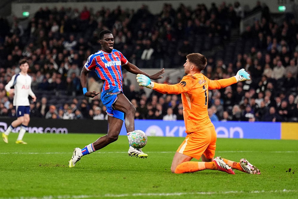 | Photo: John Walton/PA via AP : Crystal Palaces Ismaila Sarr, left, scores their third goal of the game during the English Premier League soccer match between Tottenham Hotspur and Crystal Palace in London.