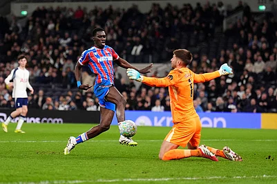 | Photo: John Walton/PA via AP : Crystal Palaces Ismaila Sarr, left, scores their third goal of the game during the English Premier League soccer match between Tottenham Hotspur and Crystal Palace in London.