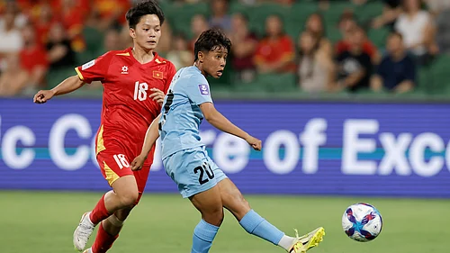 | Photo: AP/RICHARD WAINWRIGHT : Indias Sanfida Nongrum, right, scores her teams first goal as Vietnams Cù Thị Huỳnh Như looks on during the Womens Asia Cup soccer match between India and Vietnam in Perth, Australia, Wednesday, March 4, 2026.