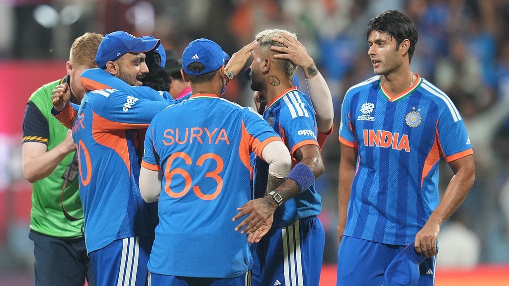 AP Photo/Rafiq Maqbool : Indian players celebrate after their win in the T20 World Cup cricket semi-final match against England in Mumbai, India, Thursday, March 5, 2026.