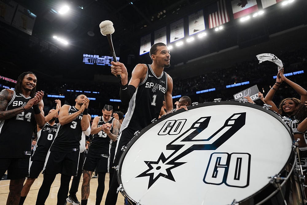 | Photo: AP/Eric Gay : San Antonio Spurs forward Victor Wembanyama (1) and teammates celebrate this win over Detroit Pistons in an NBA basketball game in San Antonio.