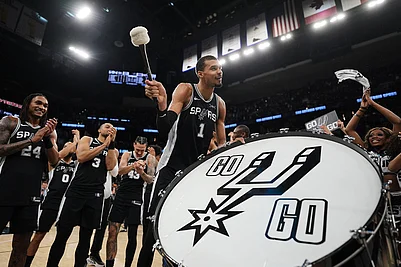 | Photo: AP/Eric Gay : San Antonio Spurs forward Victor Wembanyama (1) and teammates celebrate this win over Detroit Pistons in an NBA basketball game in San Antonio.