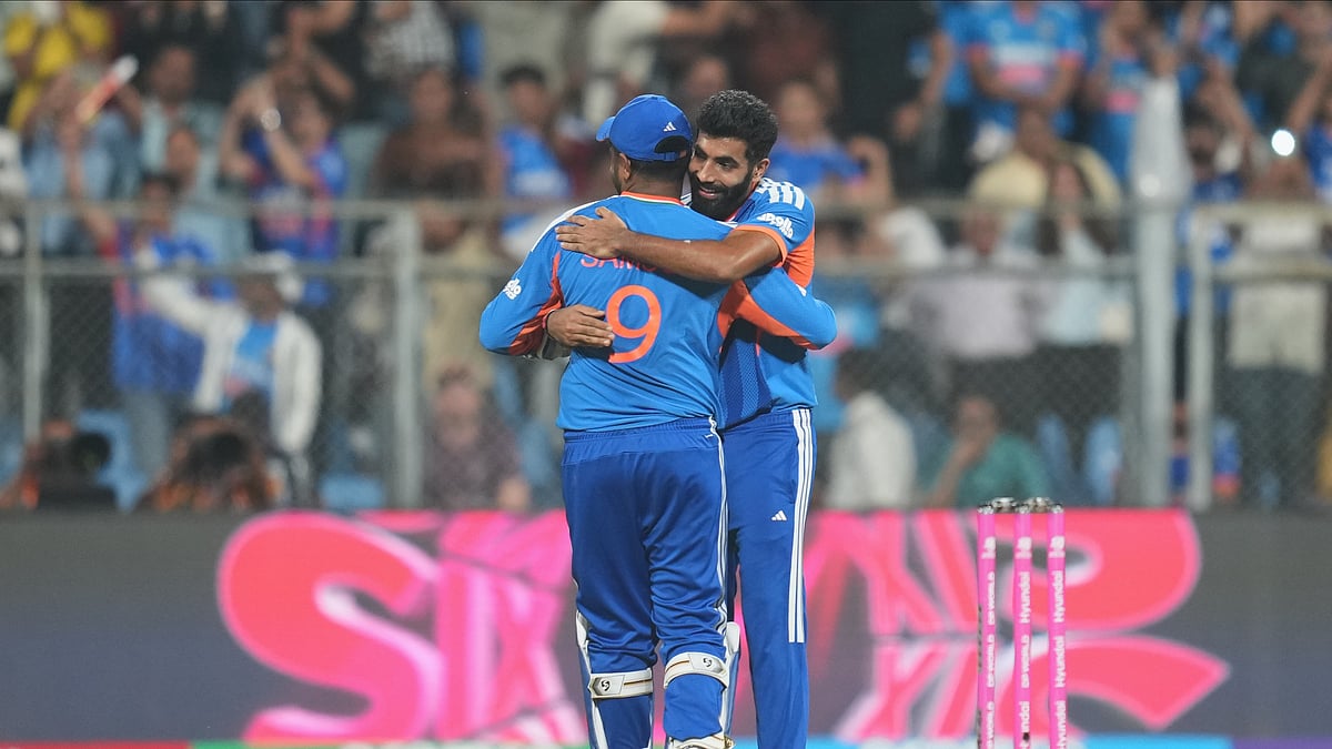 (AP Photo/Rafiq Maqbool) : Indias Jasprit Bumrah, right, hugs teammate Sanju Samson to celebrate their win in the T20 World Cup cricket semi-final match against England in Mumbai, India, Thursday, March 5, 2026.