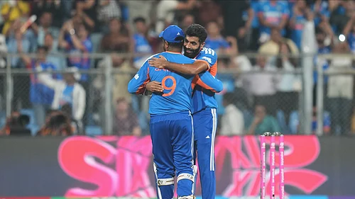 (AP Photo/Rafiq Maqbool) : Indias Jasprit Bumrah, right, hugs teammate Sanju Samson to celebrate their win in the T20 World Cup cricket semi-final match against England in Mumbai, India, Thursday, March 5, 2026.