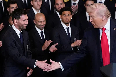 | Photo: AP/Alex Brandon : President Donald Trump shakes hands with Lionel Messi at an event to honor the 2025 Major League Soccer champions Inter Miami CF in the East Room of the White House in Washington.