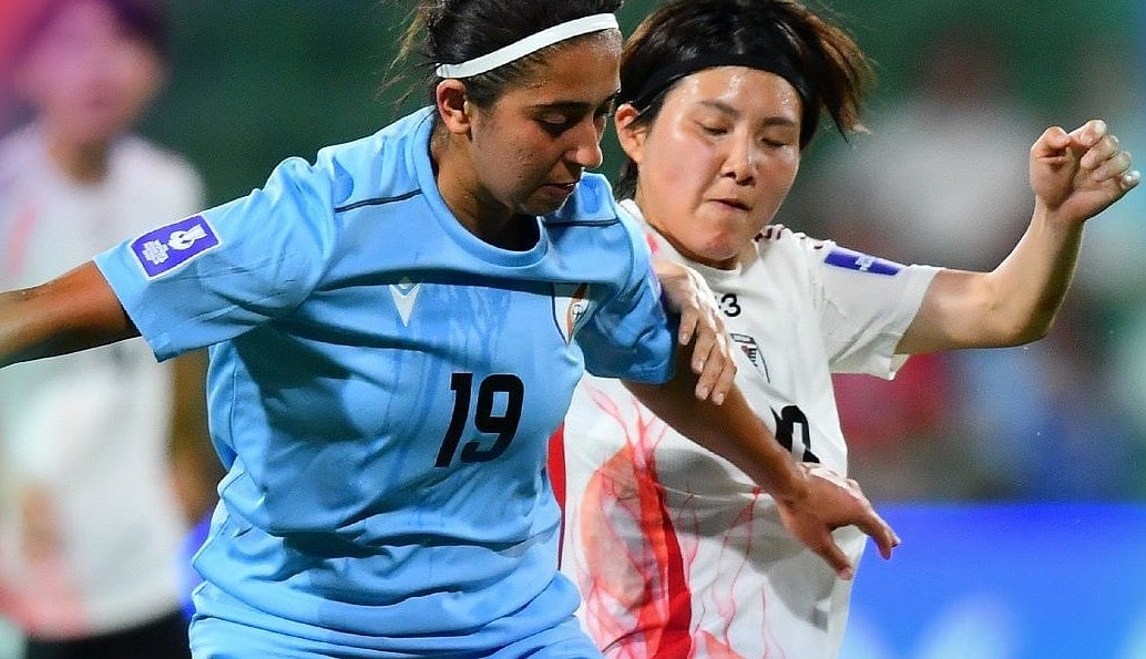 afcasiancup/X : Indian footballers competing with the Japan footballers for the ball during India vs Japan AFC Women's Asian Cup 2026 match. 