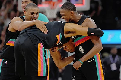 | Photo: AP/Darren Abate : San Antonio Spurs players Victor Wembanyama, center, DeAaron Fox (4) and Keldon Johnson celebrate their win after an NBA basketball game against the Los Angeles Clippers in San Antonio.