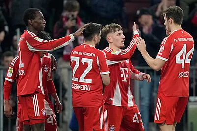 | Photo: AP/Matthias Schrader : Bayerns Nicolas Jackson, left, celebrates with team mates Raphael Guerreiro (22), Lennart Karl (42) and Josip Stanisic (44) after scoring his sides fourth goal during the Bundesliga soccer match between FC Bayern Munich and Borussia Moenchengladbach in Munich, Germany.