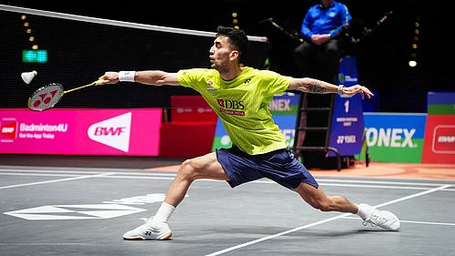 Photo: David Davies/PA via AP : Indias Lakshya Sen plays a shot against Chinas Li Shi Feng during a mens singles quarterfinals match on day four of the All England Open Badminton Championships in Birmingham.