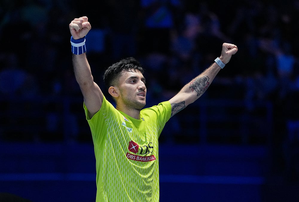 | Photo: AP/Kin Cheung : Indias Lakshya Sen celebrates after winning the mens singles semifinal match against Canadas Victor Lai at the All England Open Badminton Championships in Birmingham, England.