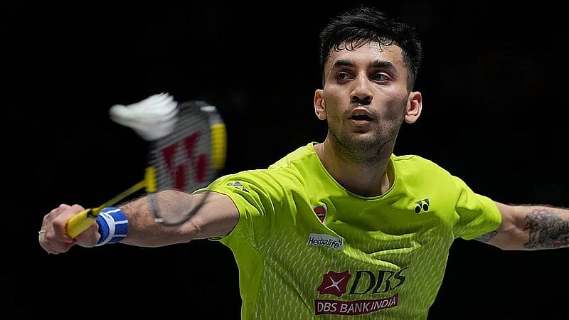 Photo: AP : Indias Lakshya Sen plays against Canadas Victor Lai during the mens singles semifinal match at the All England Open Badminton Championships in Birmingham, England.