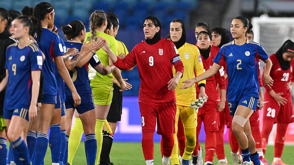 | Photo: AP/DAVE HUNT : Iran's Zahra Ghanbari, center, gestures to the Philippines players following the Women's Asian Cup soccer match between Iran and the Philippines in Robina, Australia, Sunday, March 8, 2026.