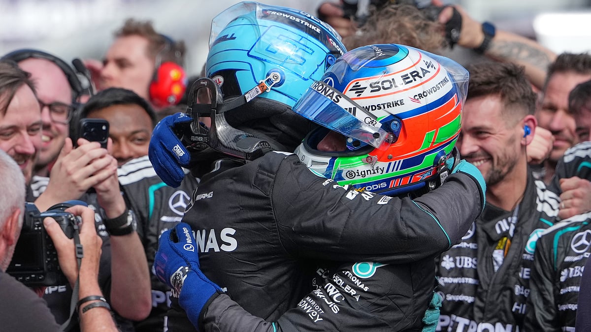 AP/Asanka Brendon Ratnayake : Mercedes driver George Russell, left, of Britain embraces teammate Andrea Kimi Antonelli of Italy after winning the Australian Formula One Grand Prix at Albert Park.