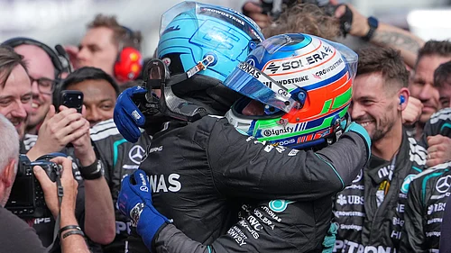 AP/Asanka Brendon Ratnayake : Mercedes driver George Russell, left, of Britain embraces teammate Andrea Kimi Antonelli of Italy after winning the Australian Formula One Grand Prix at Albert Park.