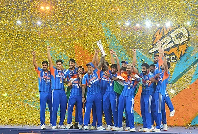 | Photo: AP/Rafiq Maqbool : Indias players celebrate with the trophy after winning the T20 World Cup final match against New Zealand, in Ahmedabad.
