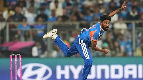 | Photo: AP/Rafiq Maqbool : Indias Mohammed Siraj bowls a delivery during the T20 World Cup cricket match between India and the United States in Mumbai.