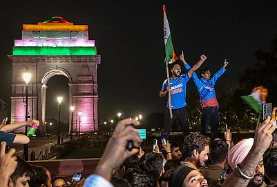 | Photo: PTI : Cricket fans celebrate after India defeated New Zealand to win the ICC Mens T20 World Cup 2026 final near India Gate, in New Delhi.