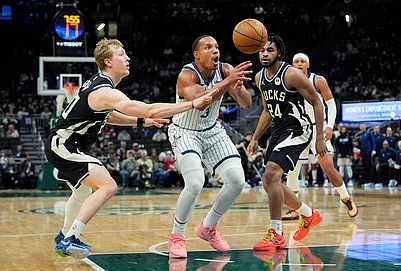 | Photo: AP/Aaron Gash : Orlando Magics Desmond Bane (3) loses control of the ball between Milwaukee Bucks AJ Green and Cam Thomas during the second half of an NBA basketball game in Milwaukee.