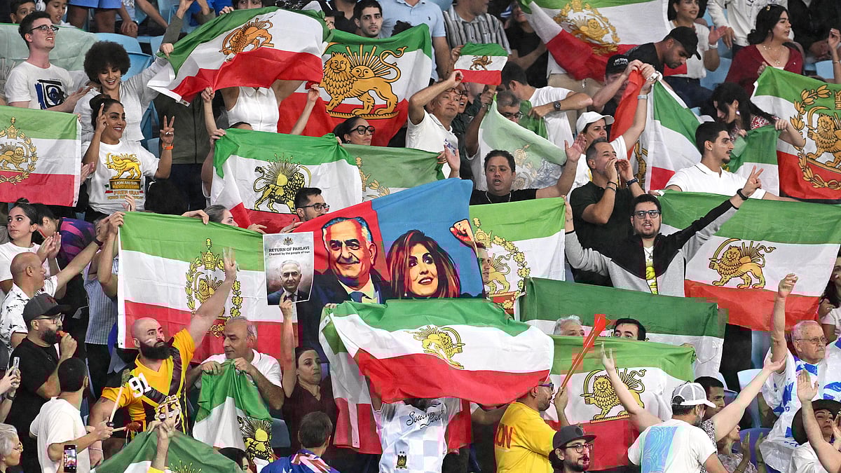 | Photo: AP/DAVE HUNT : Iran supporters wave flags during the Women's Asian Cup soccer match between Iran and the Philippines in Robina, Australia, Sunday, March 8, 2026.