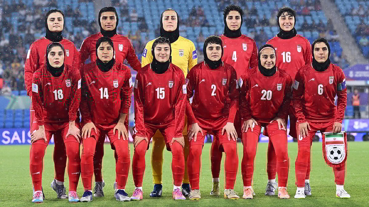| Photo: AP/DAVE HUNT : Iran players pose for a team photo ahead of the Women's Asian Cup soccer match between Iran and the Philippines in Robina, Australia, Sunday, March 8, 2026. 