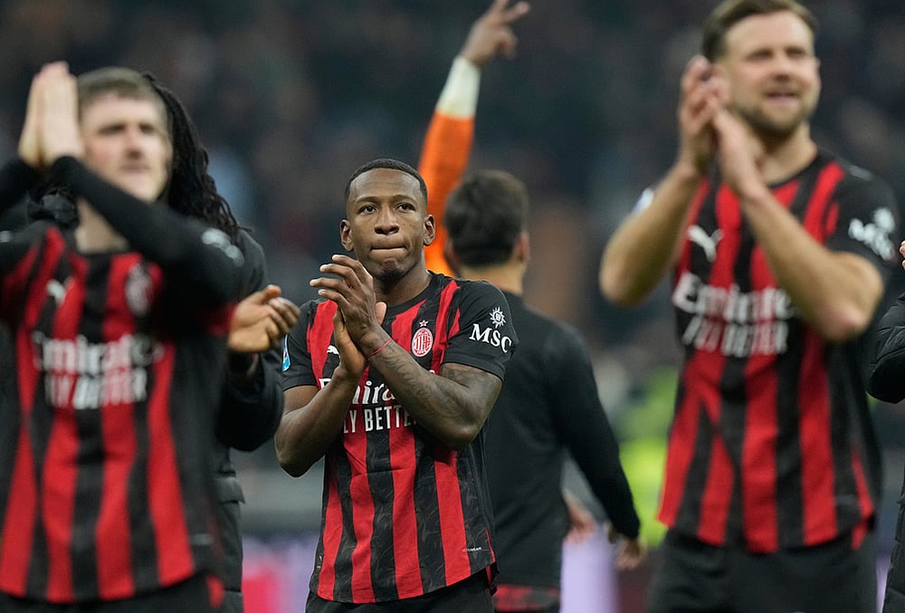 | Photo: AP/Luca Bruno : AC Milan's Pervis Estupinan, centre, celebrates after the Serie A soccer match between AC Milan and Inter Milan, in Milan, Italy.