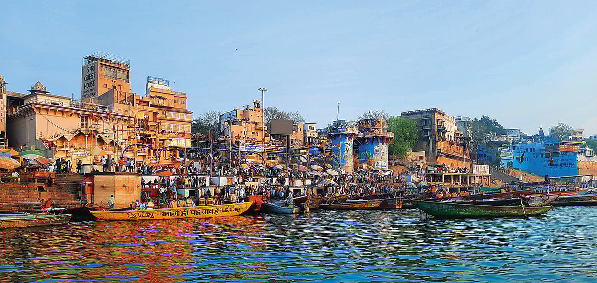 Boats line the busy ghats of Varanasi as people gather along the Ganges riverfront