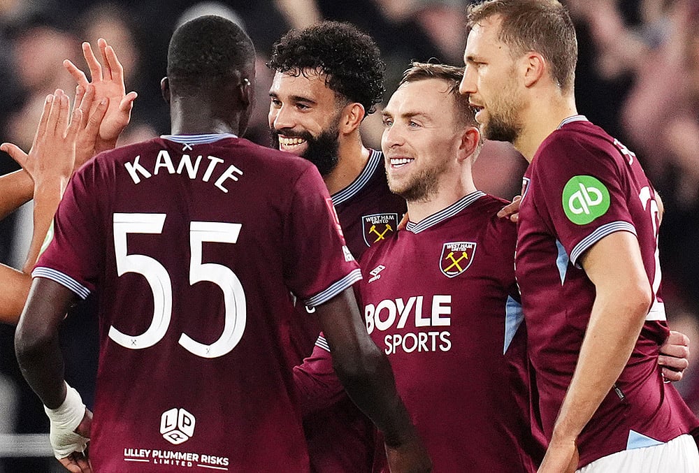 | Photo: John Walton/PA via AP : West Ham Uniteds Jarrod Bowen, second right, celebrates scoring with teammates during the English FA Cup fifth round soccer match between West Ham United and Brentford in London.