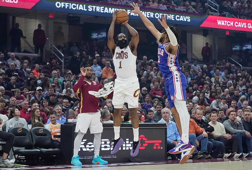 | Photo: AP/Sue Ogrocki : Cleveland Cavaliers guard James Harden (1) shoots as Philadelphia 76ers forward Trendon Watford (12) defends and teammate Donovan Mitchell, left, looks on in the first half of an NBA basketball game in Cleveland.